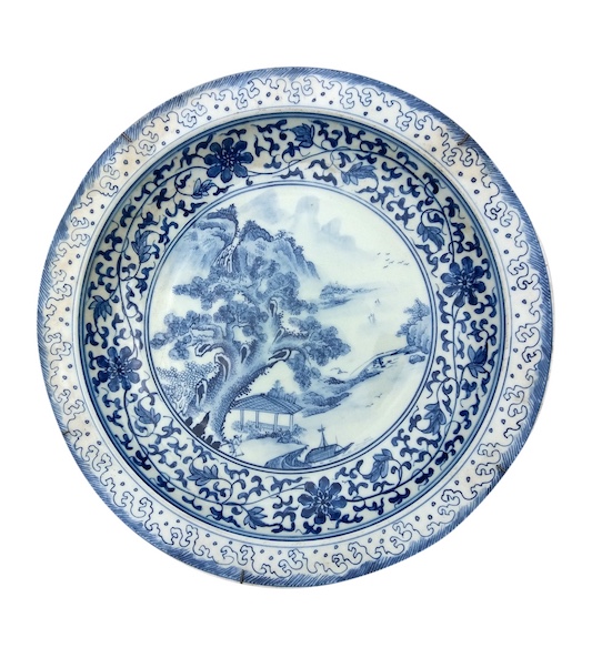 A modern Chinese blue and white basin with landscape